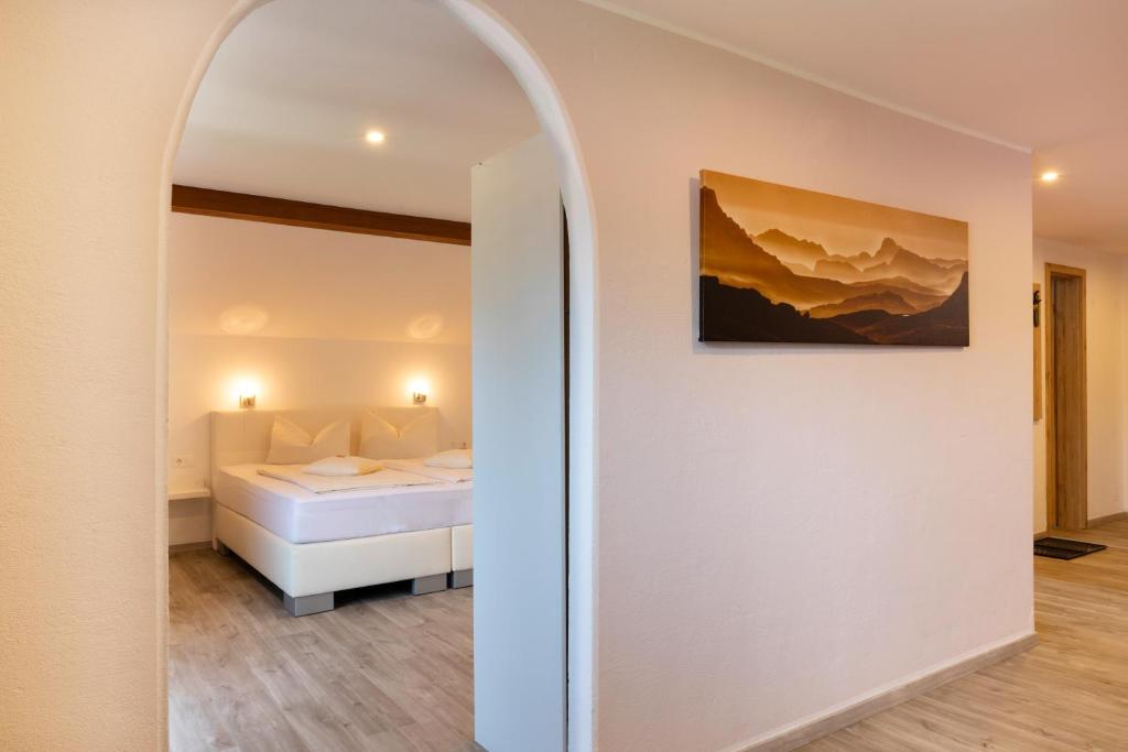 Postel nebo postele na pokoji v ubytování Hotel Garni Bergidyll - adults only