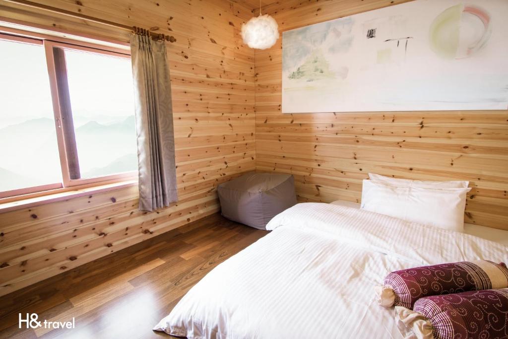 Postel nebo postele na pokoji v ubytování Alishan Sunrise B&B