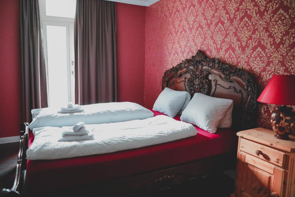 Postel nebo postele na pokoji v ubytování Historisches Hotel Bären