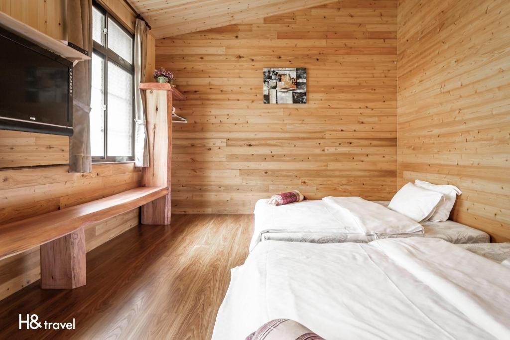 Postel nebo postele na pokoji v ubytování Alishan Sunrise B&B