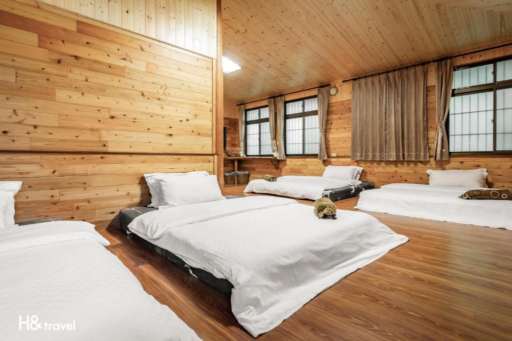Postel nebo postele na pokoji v ubytování Alishan Sunrise B&B