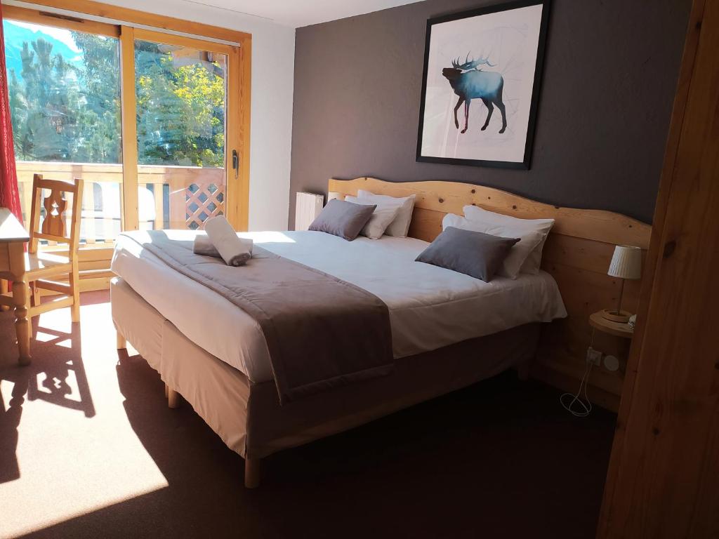 Postel nebo postele na pokoji v ubytování Hôtel Aalborg