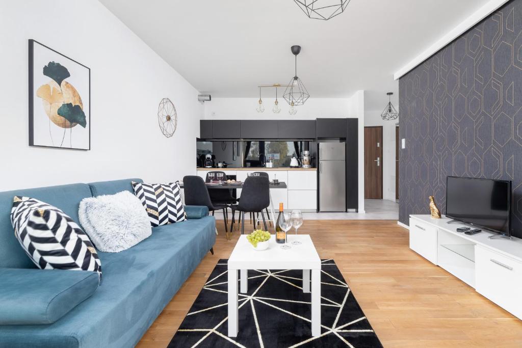 TV a/nebo společenská místnost v ubytování Riva Verona Apartments by Renters Prestige