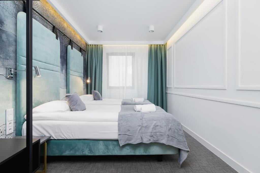 Postel nebo postele na pokoji v ubytování Riva Verona Apartments by Renters Prestige