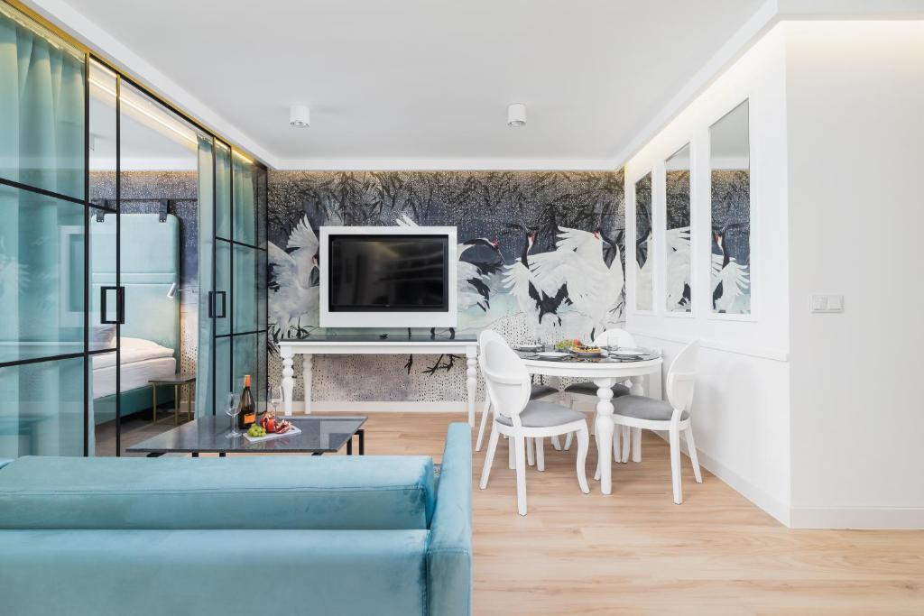 TV a/nebo společenská místnost v ubytování Riva Verona Apartments by Renters Prestige