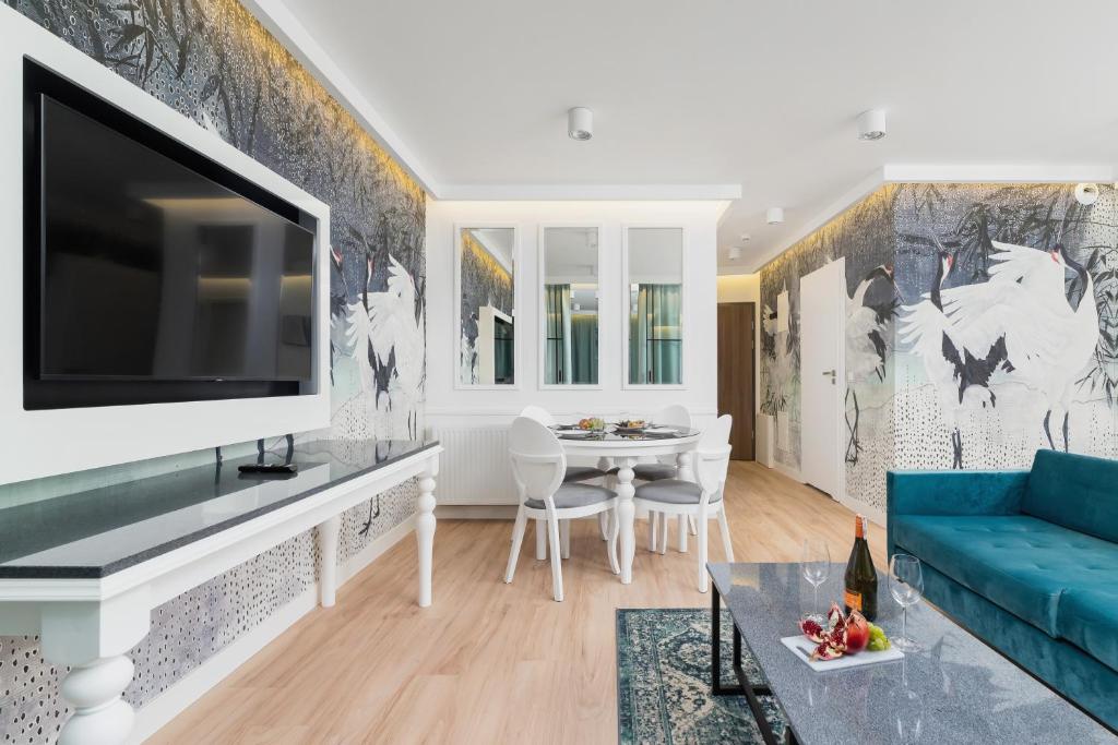 TV a/nebo společenská místnost v ubytování Riva Verona Apartments by Renters Prestige