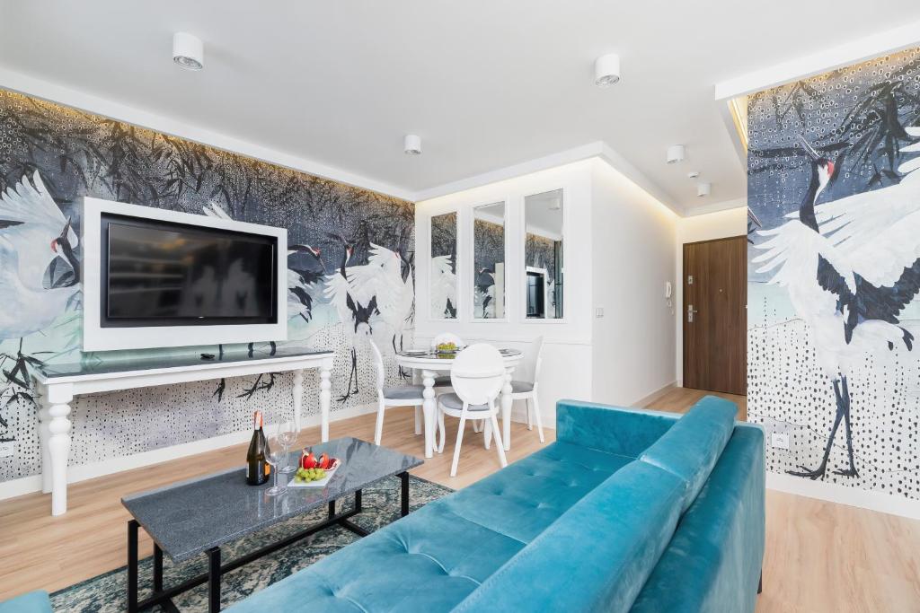 TV a/nebo společenská místnost v ubytování Riva Verona Apartments by Renters Prestige