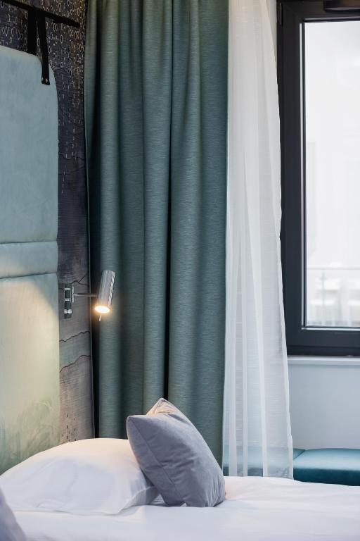 Postel nebo postele na pokoji v ubytování Riva Verona Apartments by Renters Prestige