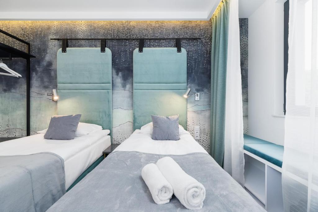 Postel nebo postele na pokoji v ubytování Riva Verona Apartments by Renters Prestige