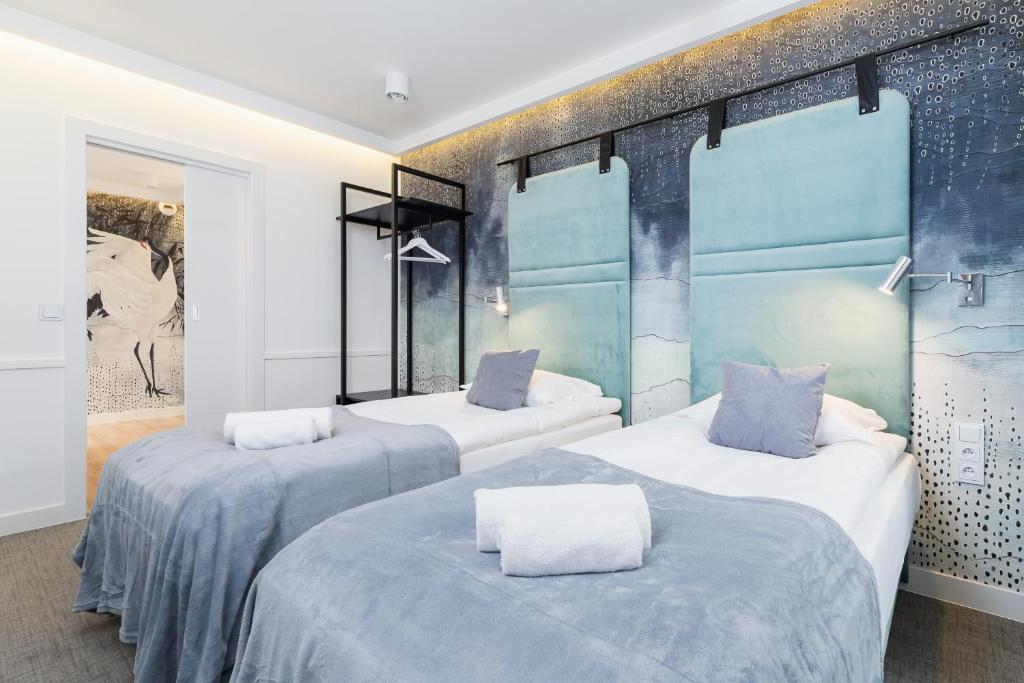 Postel nebo postele na pokoji v ubytování Riva Verona Apartments by Renters Prestige