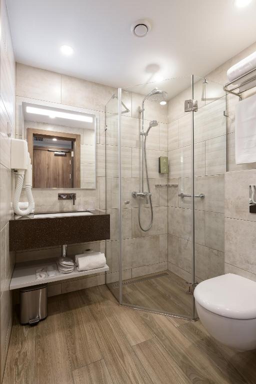 Koupelna v ubytování Premier Hotel Odesa