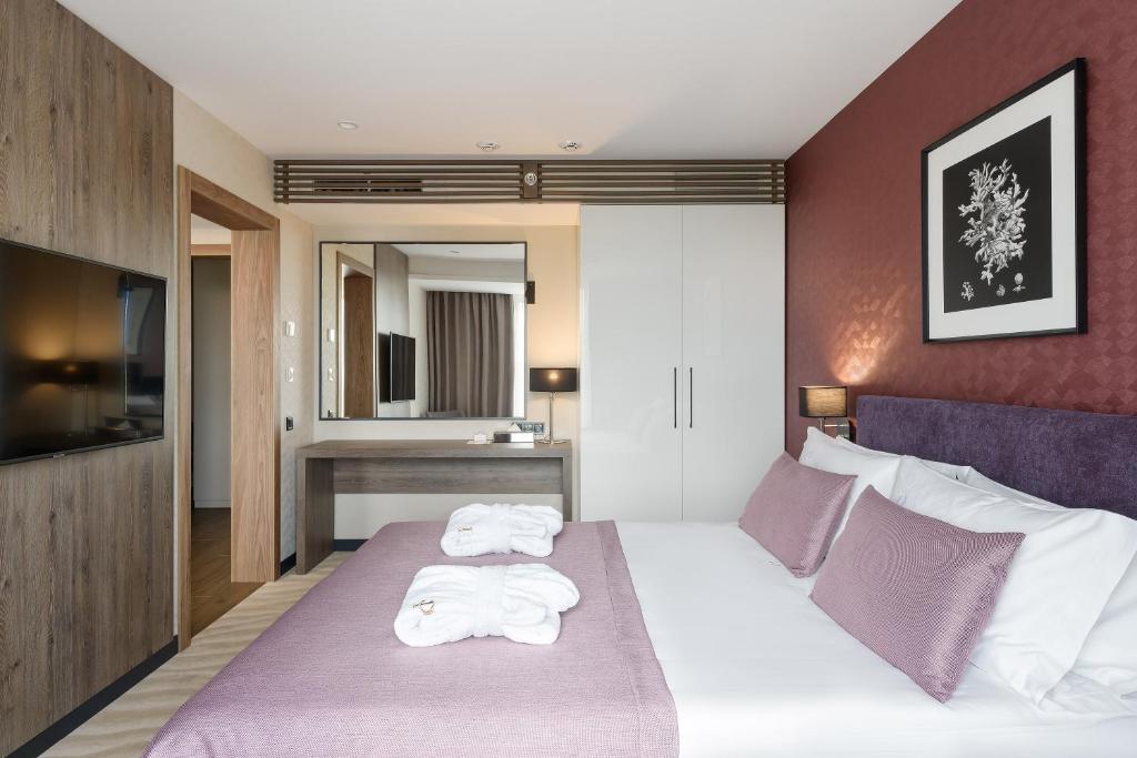 Postel nebo postele na pokoji v ubytování Premier Hotel Odesa