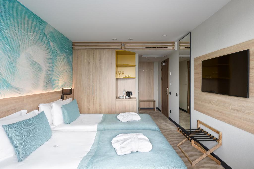 Postel nebo postele na pokoji v ubytování Premier Hotel Odesa