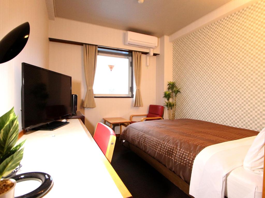 TV a/nebo společenská místnost v ubytování HOTEL LiVEMAX BUDGET Utsunomiya