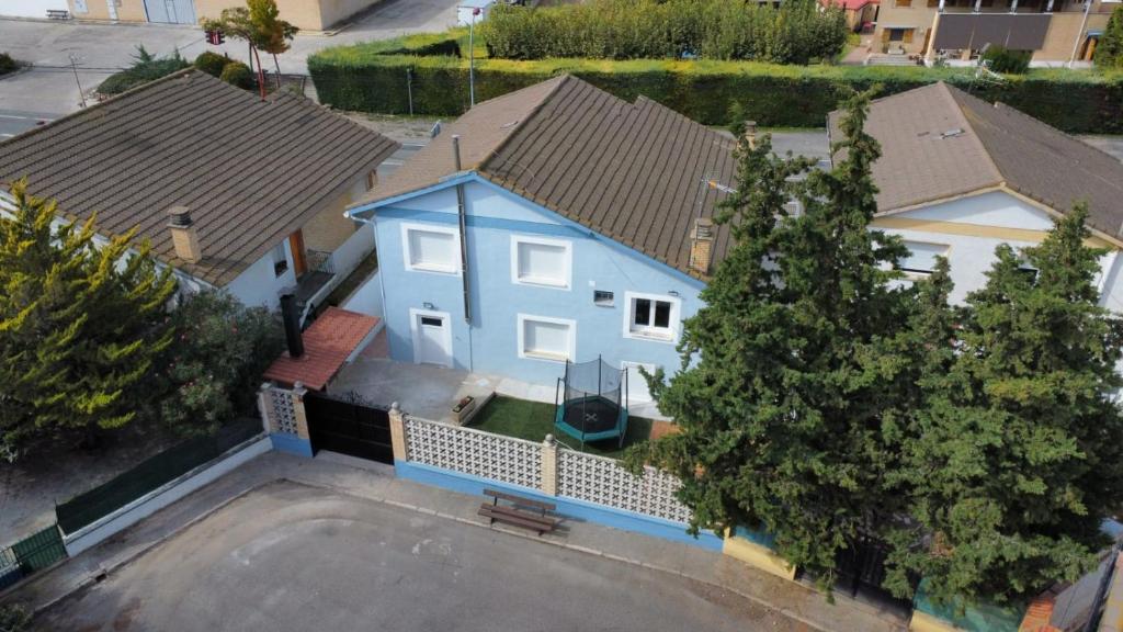 an overhead view of a blue house with trees at CasaCascante in Cascante