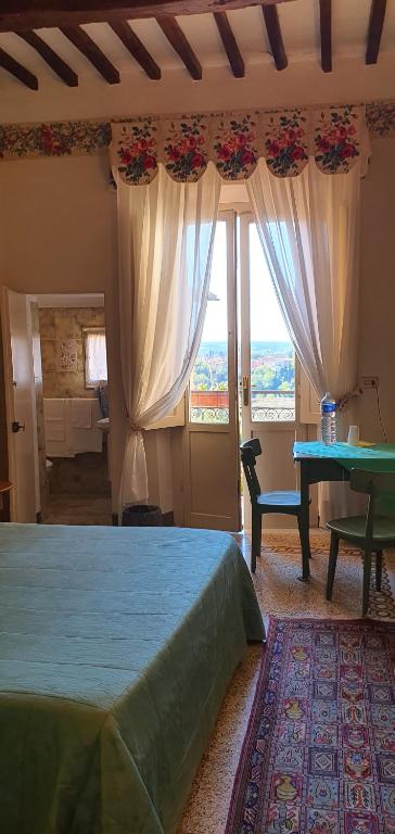 A bed or beds in a room at Soggiorno Dimora Del Grifo