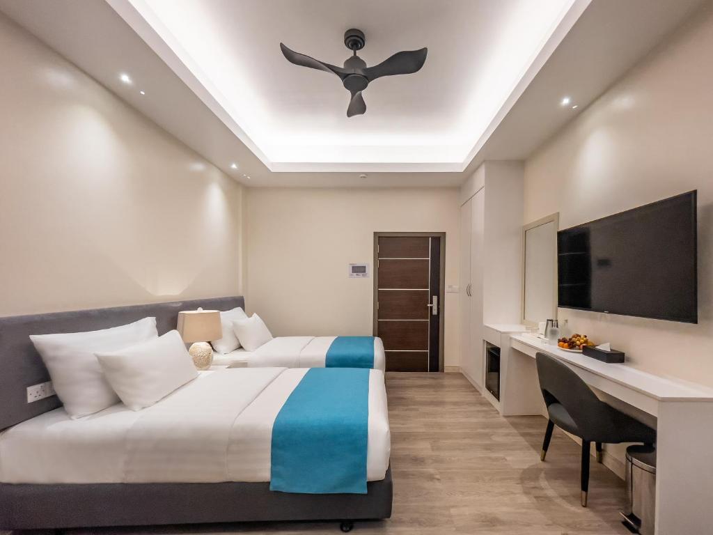 Postel nebo postele na pokoji v ubytování Sky Beach Maldives - Dhiffushi