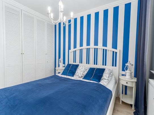 Posteľ alebo postele v izbe v ubytovaní Apartament Bliżej Morza Premium I