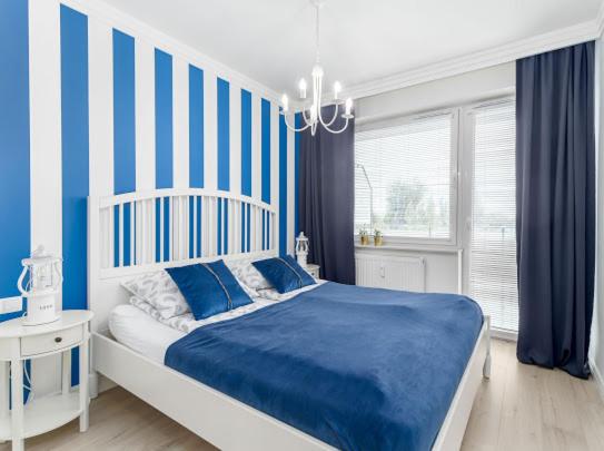 Posteľ alebo postele v izbe v ubytovaní Apartament Bliżej Morza Premium I