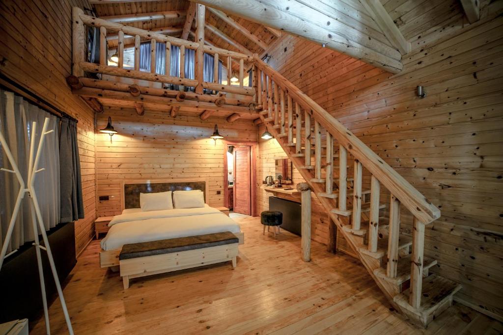 Postel nebo postele na pokoji v ubytování Pino Mar Luxury Bungalows