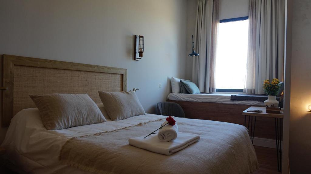 Łóżko lub łóżka w pokoju w obiekcie San Jorge Suites Triana