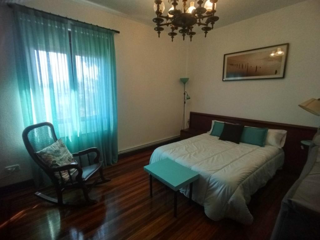 A bed or beds in a room at GARDEN ROOMS