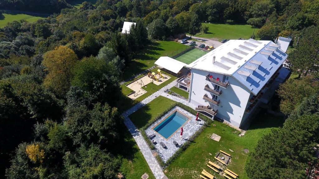 an aerial view of a house with a swimming pool at chata Trubárka in Trenčín