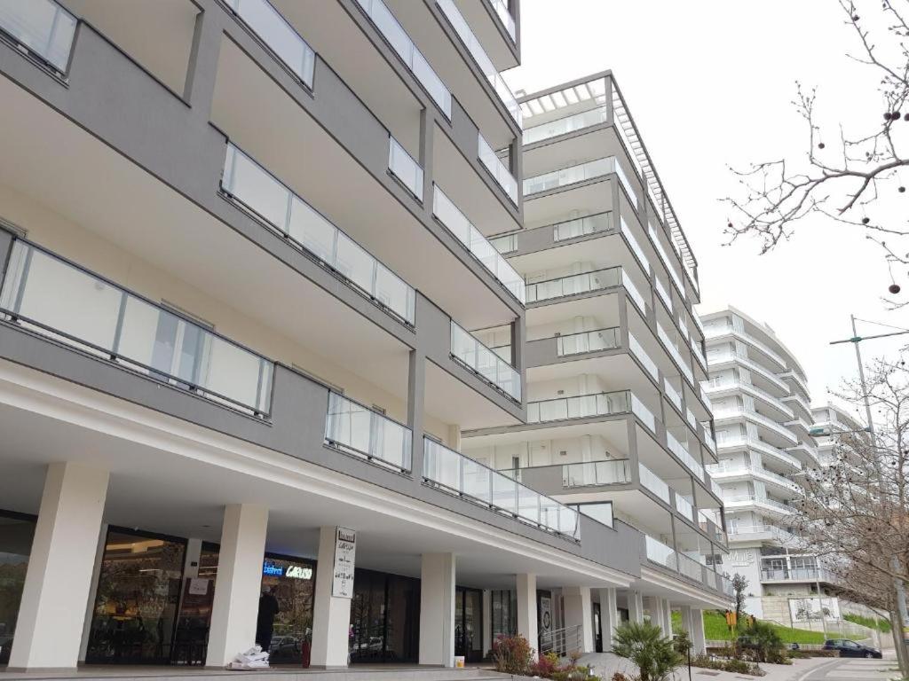 a large building with balconies on the side of it at Magnolia Guest House Salerno in Salerno