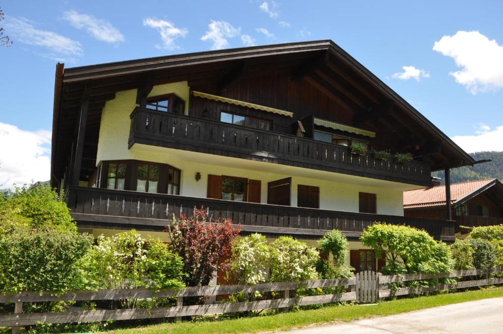 a large house with a gambrel roof at Ferienwohnung Andrea in Schleching