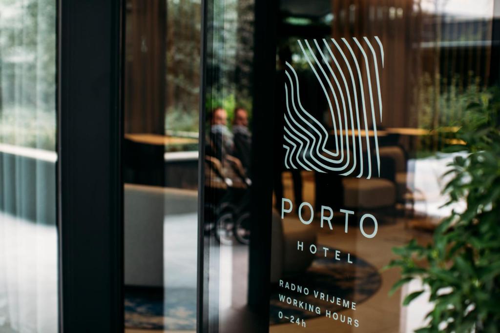 a sign on the door of a hotel at Boutique Hotel Porto in Dubrovnik