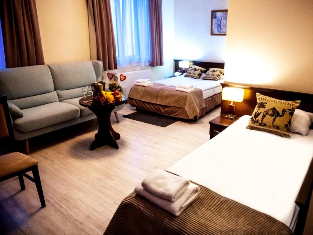 Posteľ alebo postele v izbe v ubytovaní Hotel Feniks