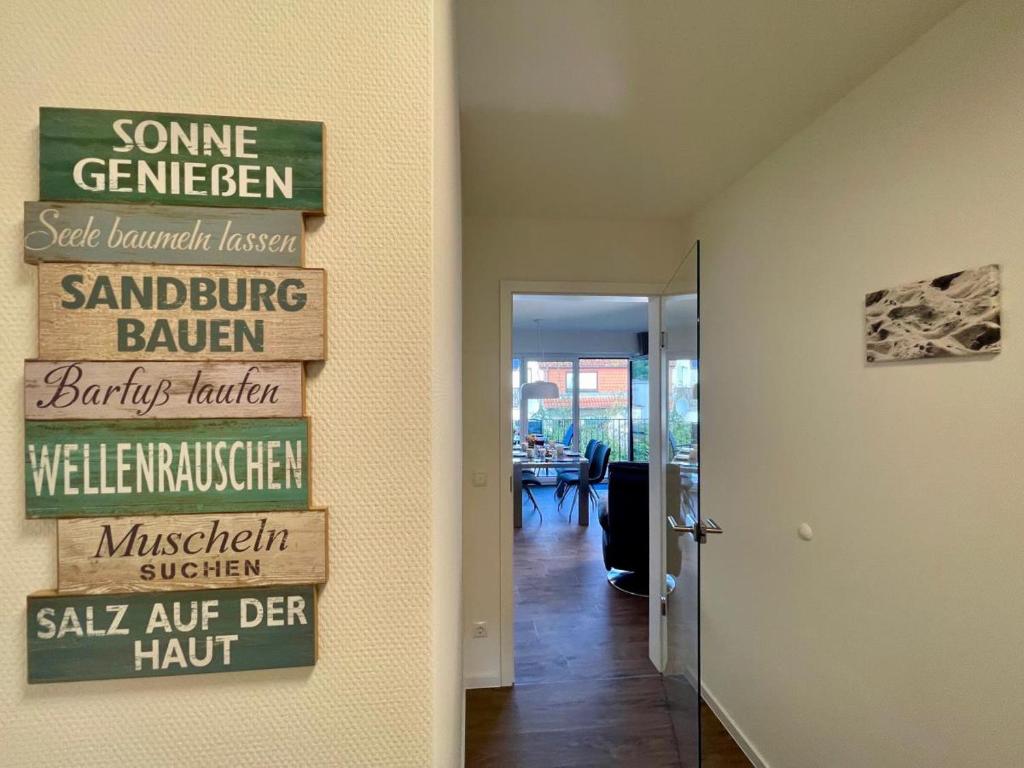 a hallway with signs on the wall of a restaurant at Dahmer Strand 9 in Dahme