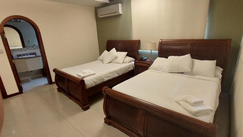 Postel nebo postele na pokoji v ubytování Hotel Voyager Manta
