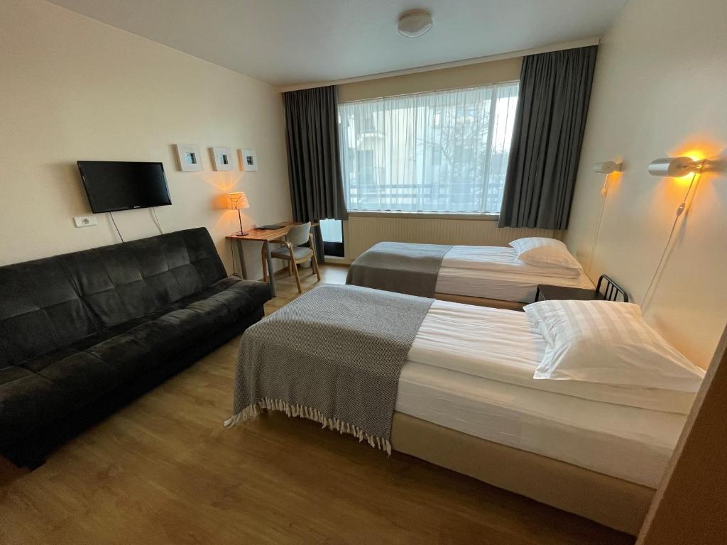 Postel nebo postele na pokoji v ubytování Guesthouse Sunna