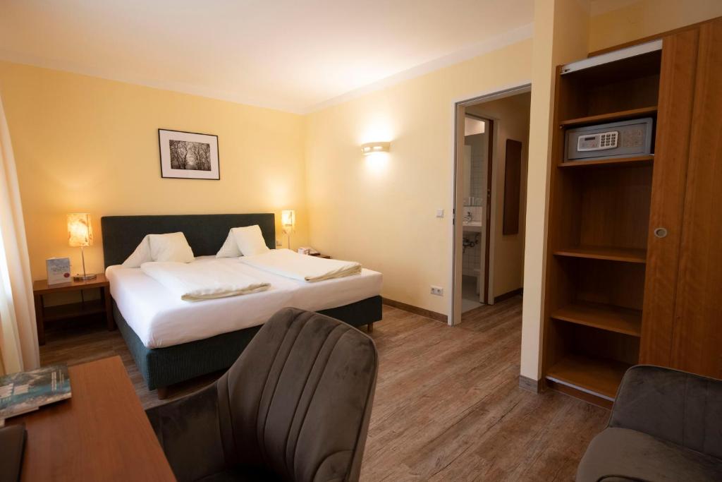 Postel nebo postele na pokoji v ubytování Landhotel Rosentaler Hof
