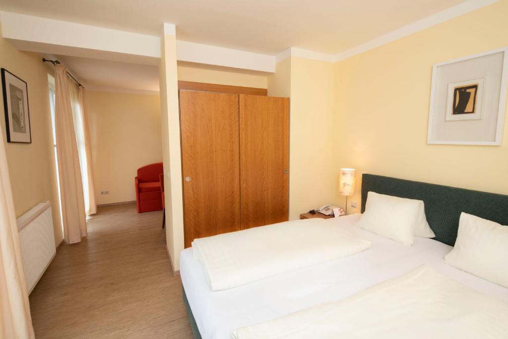 Postel nebo postele na pokoji v ubytování Landhotel Rosentaler Hof