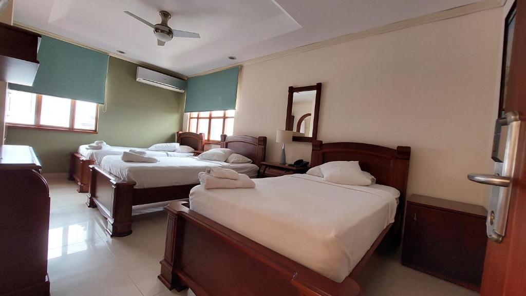 Postel nebo postele na pokoji v ubytování Hotel Voyager Manta