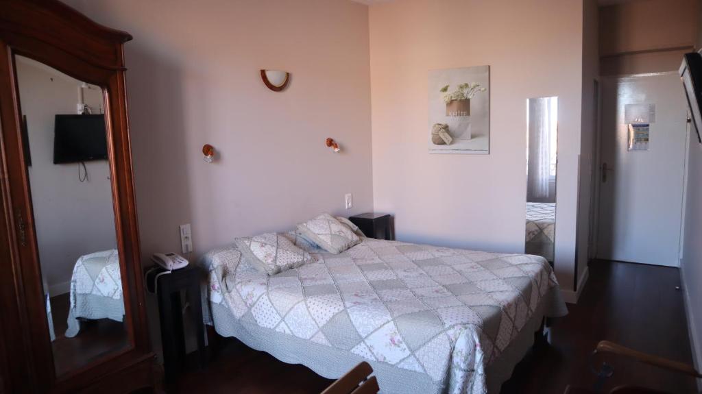 Postel nebo postele na pokoji v ubytování Hotel Du Forum