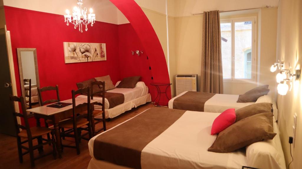 Postel nebo postele na pokoji v ubytování Hotel Du Forum
