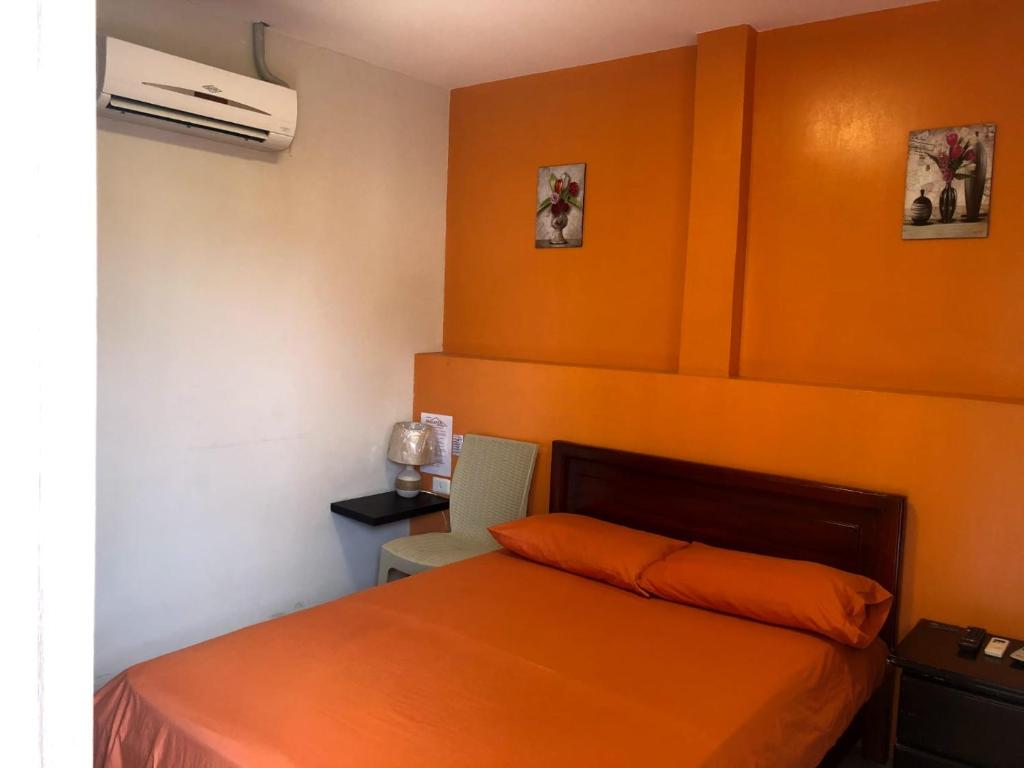 Postel nebo postele na pokoji v ubytování Hostal Malania