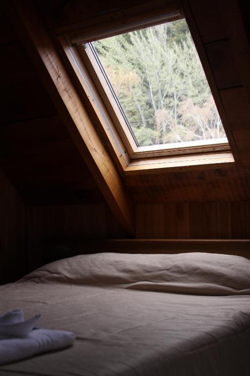 Postel nebo postele na pokoji v ubytování Wesley House Hosteria Boutique