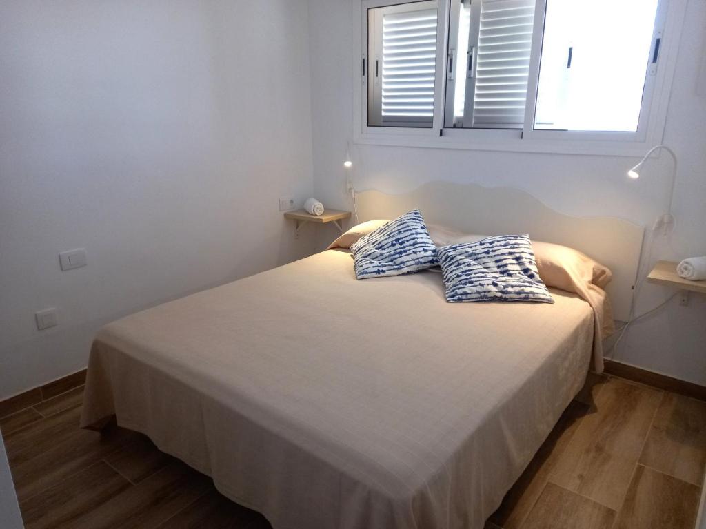 Posteľ alebo postele v izbe v ubytovaní Apartamentos Medano - Marineda Medano
