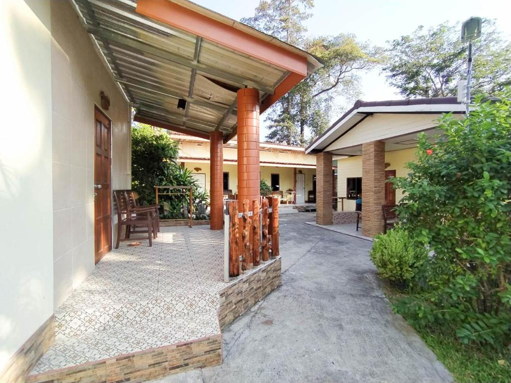 an outdoor patio with awning on a house at Samet Bellhouse in Ko Samed