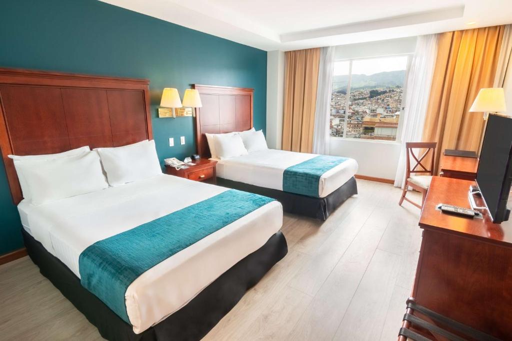 Postel nebo postele na pokoji v ubytování Sonesta Hotel Loja