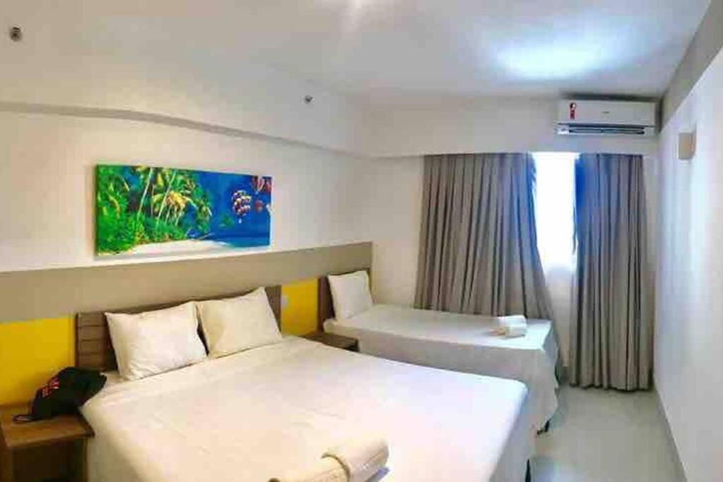En eller flere senger på et rom på Olimpia Park Resort