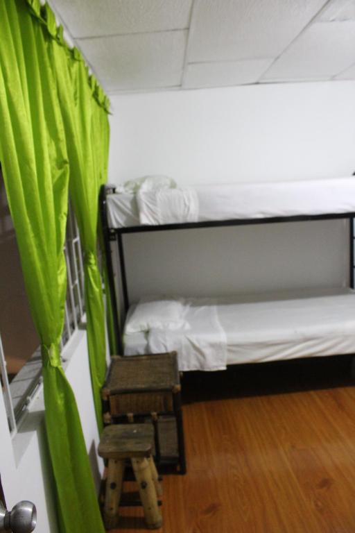 Postel nebo postele na pokoji v ubytování Hostal Cafe San Bernabe