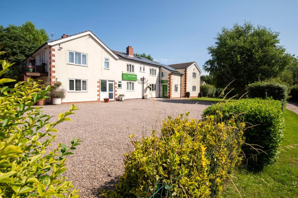 a house with a driveway in front of it at Bridleways Guesthouse & Holiday Homes in Mansfield