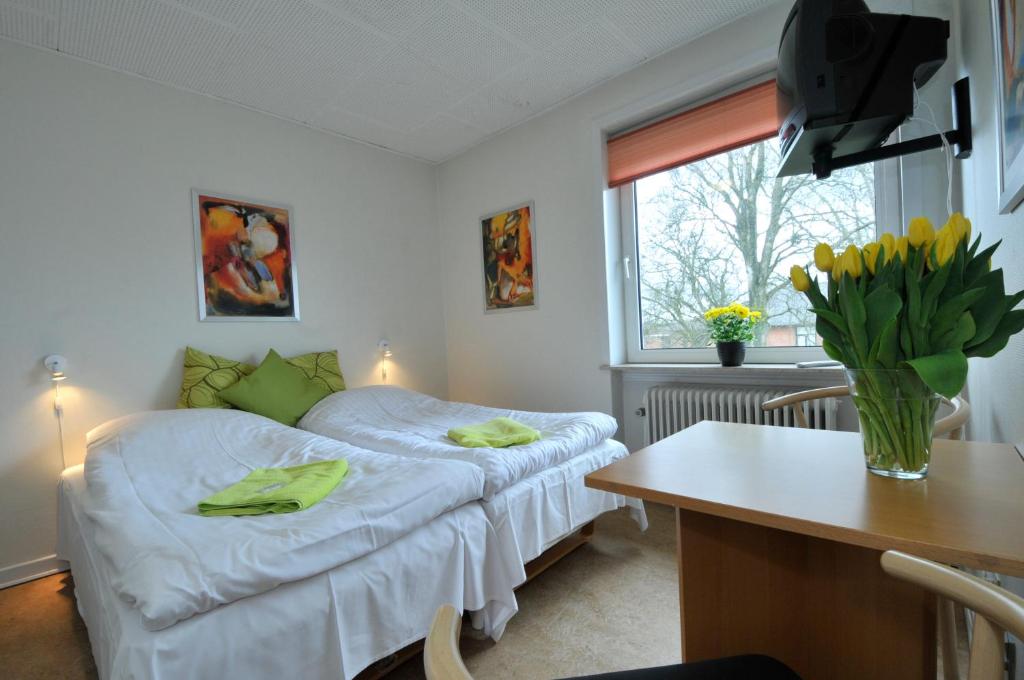 Postel nebo postele na pokoji v ubytování Thyregod Kursuscenter