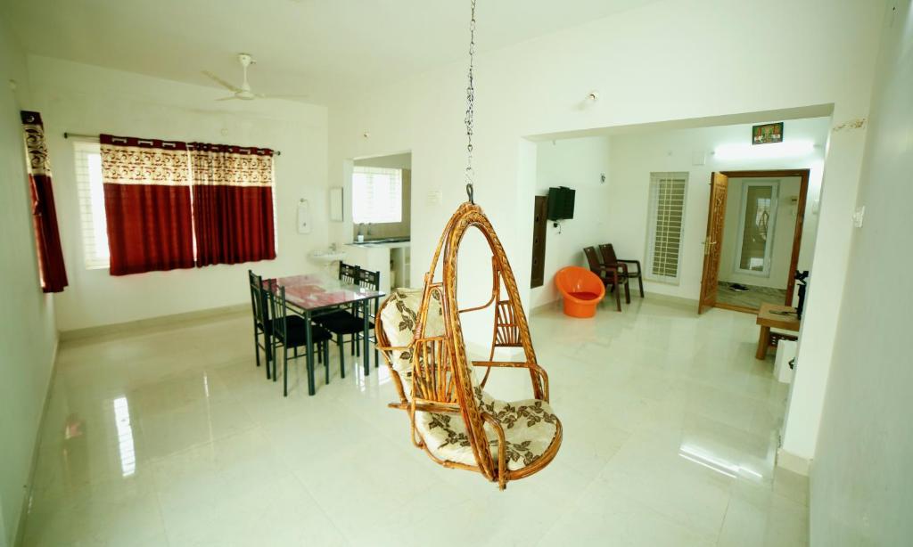 a living room with a slide in a house at TrueLife Homestays - Alamelu Avenue - Fully Furnished AC 2BHK Apartments in Tirupati - Walkable to Restaurants & Super Market - Fast WiFi - Kitchen - Easy access to Airport, Railway Station, Sri Padmavathi & Tirumala Temple in Tirupati