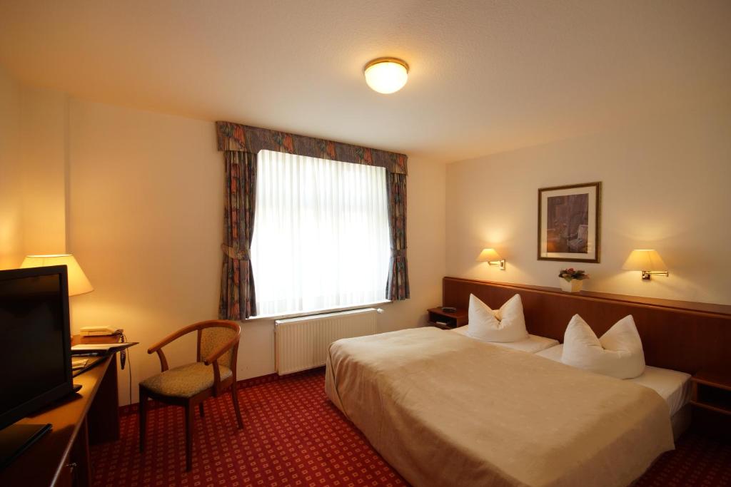 Postel nebo postele na pokoji v ubytování Hotel Fürsteneck